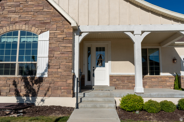 1222 West 190th Street North Mapleton, UT 84664 - Photo 43 of 46 Stone and stucco facade with a covered porch featuring decorative columns