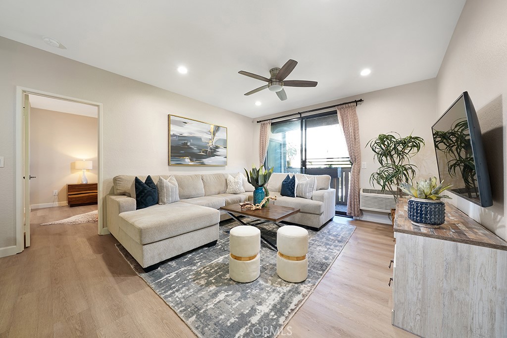 20702 El Toro Road, Unit 397 Lake Forest, CA 92630 - Photo 1 of 11 Spacious living area, with ceiling fan, opens to patio