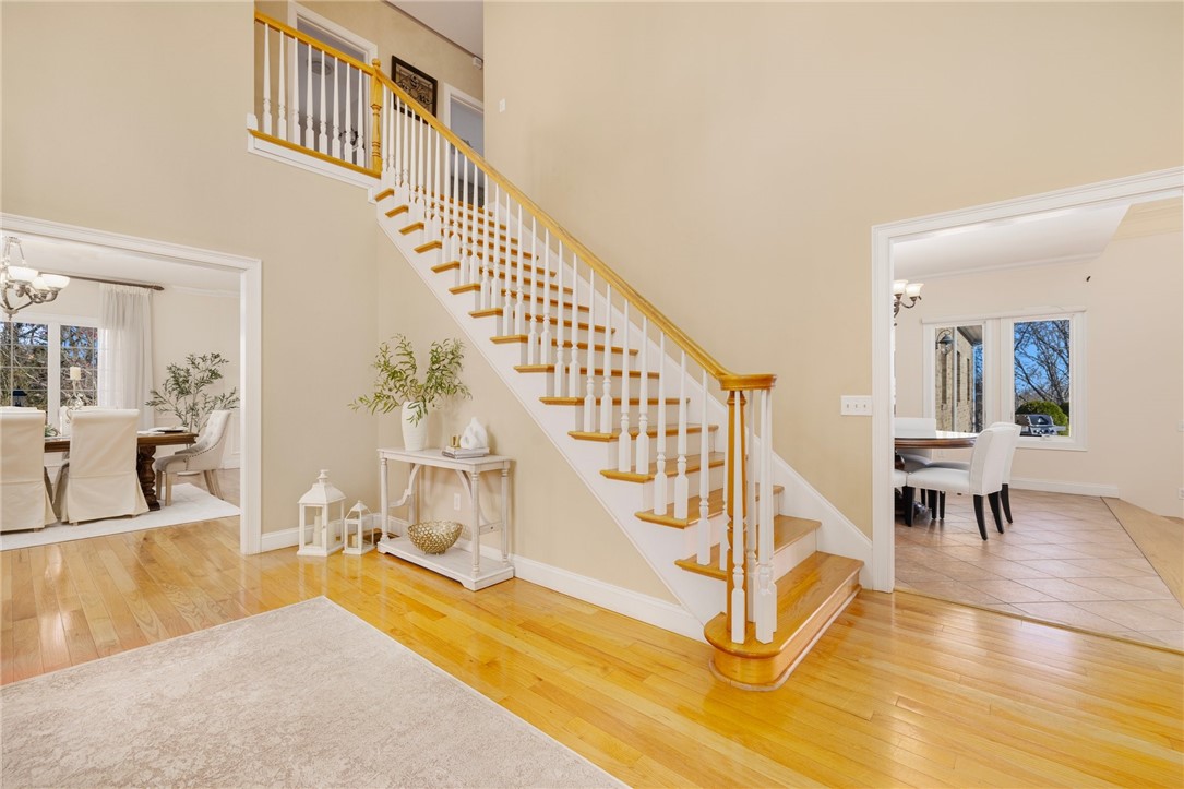 195 Ridge Road South Kingstown, RI 02879 - Photo 8 of 50 A foyer view showing the staircase being central to the layout of the house.