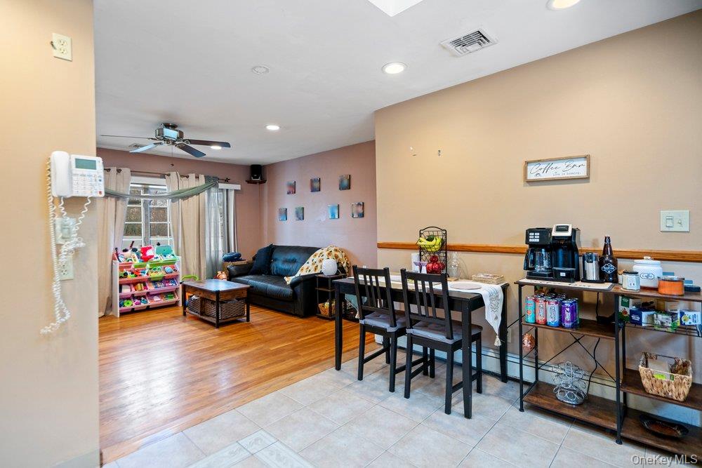 101 Sexton Road West Babylon, NY 11704 - Photo 15 of 33 a living room with lots of furniture and a wooden floor