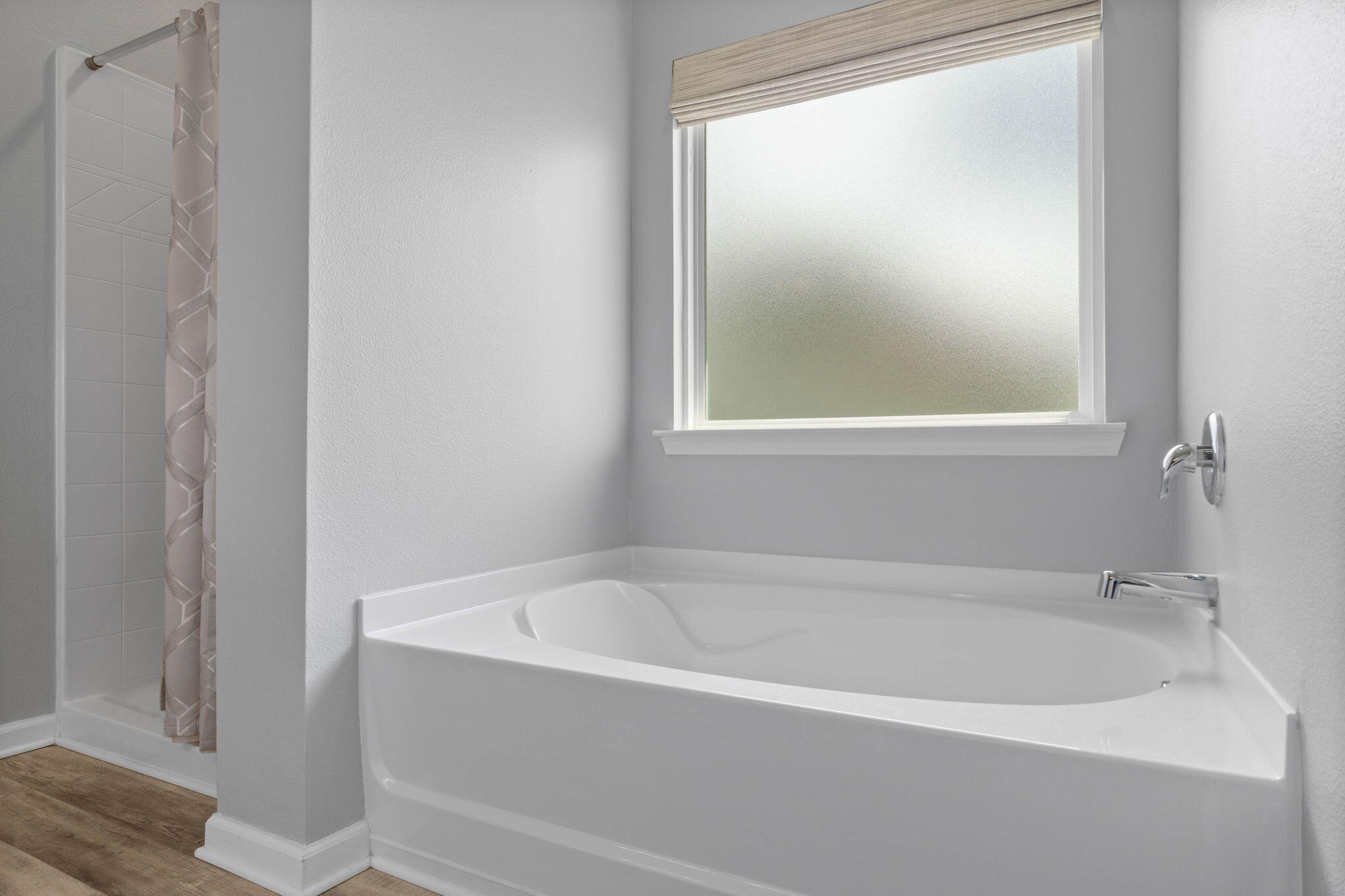 38 Silverthorn Street Freeport, FL 32439 - Photo 22 of 42 a white bath tub sitting next to a window