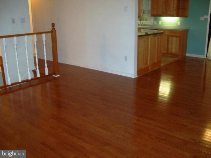 6104 Ridge Tree Road Fredericksburg, VA 22407 - Photo 3 of 26 a view of a hallway with wooden floor