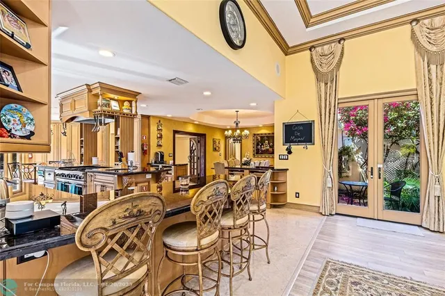 a very nice looking living room with furniture a fireplace and a floor to ceiling window