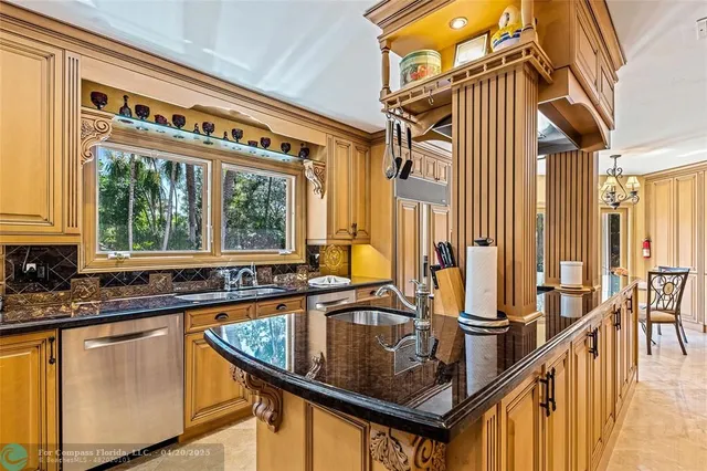 a view of a kitchen with a large window