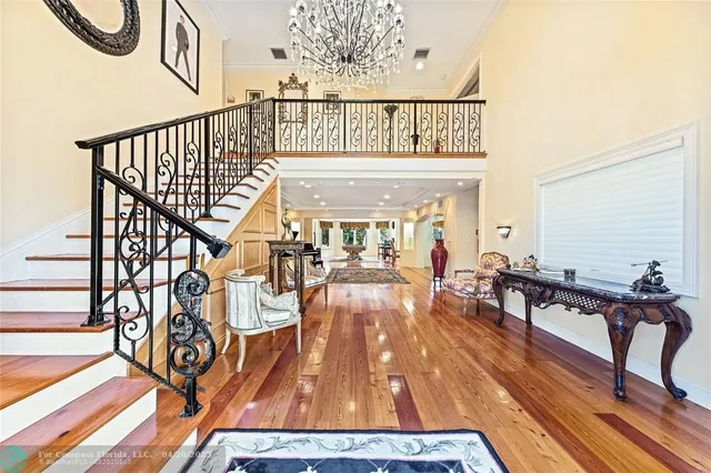 a view of entryway livingroom and hall with wooden floor