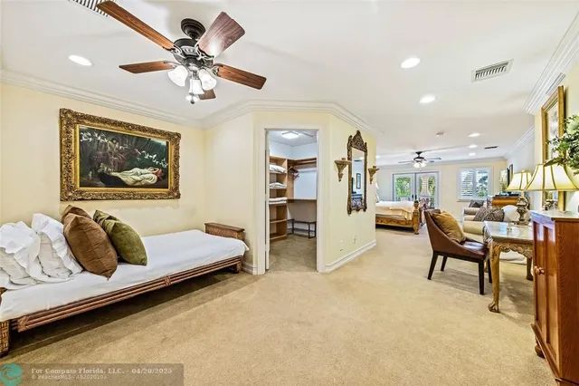 a living room with furniture and ceiling fan