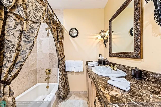 a bathroom with a bathtub and shower