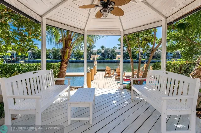 a view of a patio with a table chairs and a table