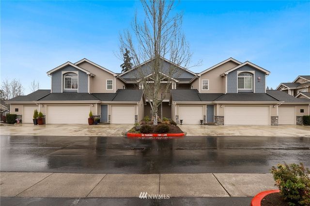a front view of a house with garage