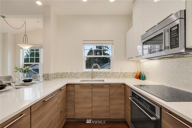 a kitchen with a sink and a microwave