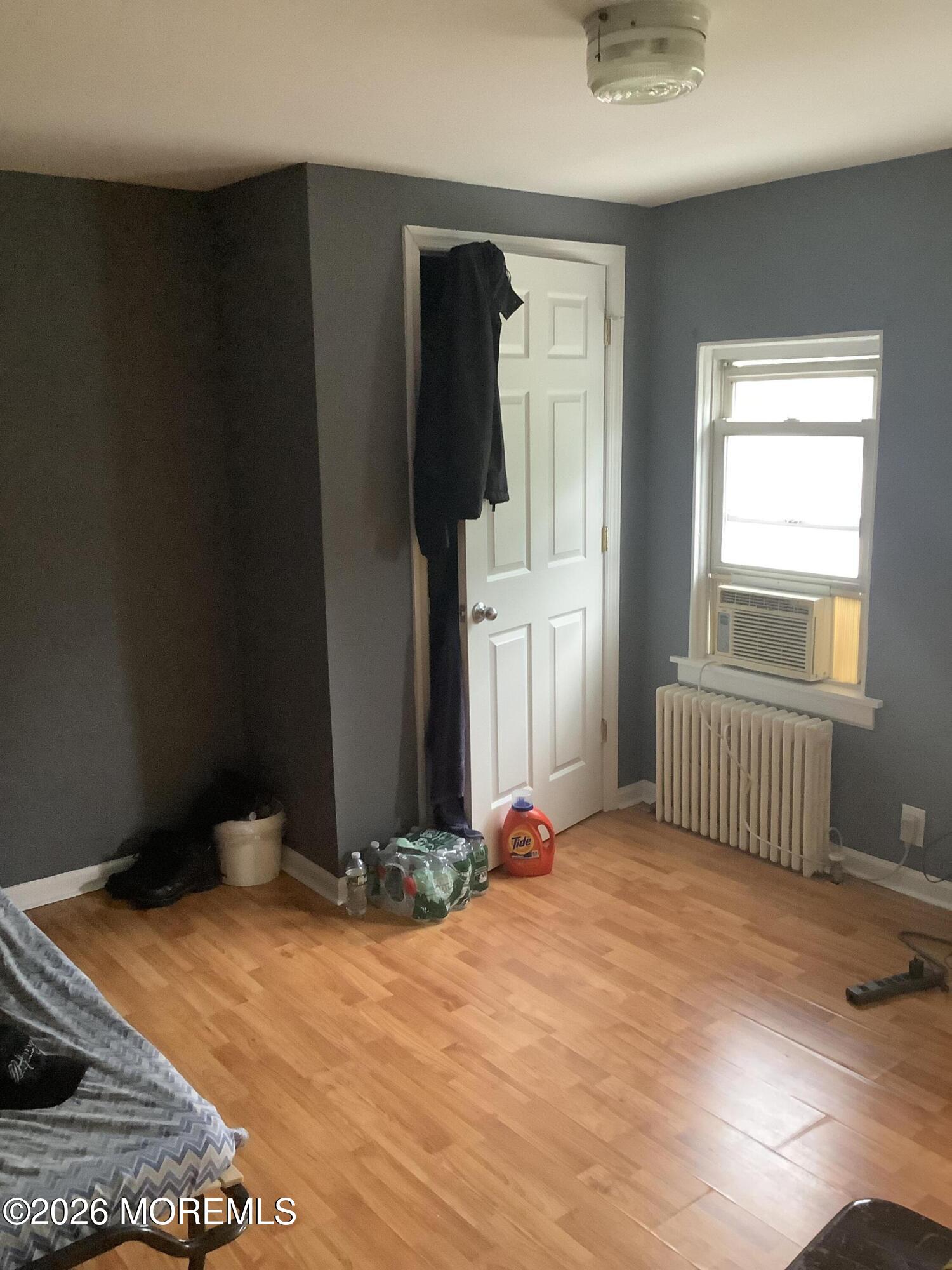 242 1st Street Keyport, NJ 07735 - Photo 18 of 23 a bedroom with a bed and a window