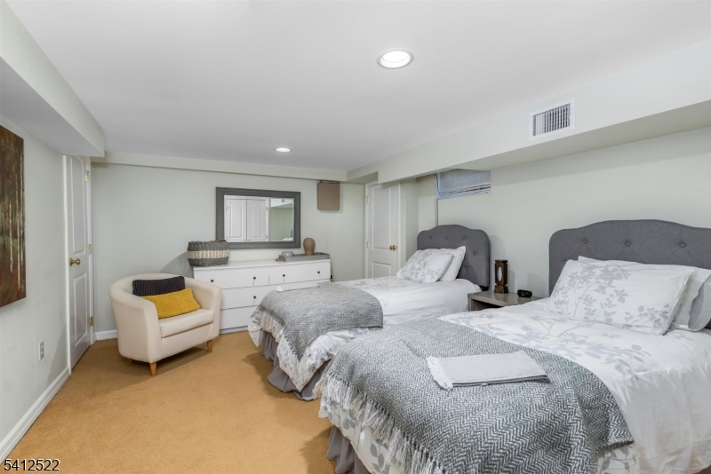 6 Harding Court Passaic, NJ 07055 - Photo 11 of 17 a spacious bedroom with two beds and a couch