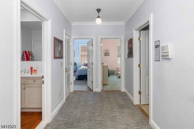 6 Harding Court Passaic, NJ 07055 - Photo 13 of 17 a view of a hallway with bathroom and wooden floor