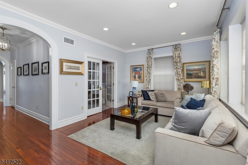 6 Harding Court Passaic, NJ 07055 - Photo 3 of 17 a living room with furniture and a wooden floor