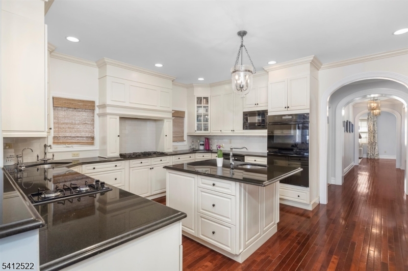 6 Harding Court Passaic, NJ 07055 - Photo 6 of 17 a kitchen with a sink stove and cabinets