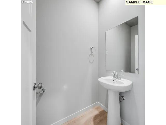 a bathroom with a sink and mirror