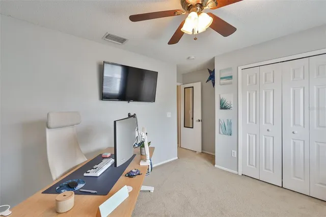 a view of a livingroom with furniture and a flat screen tv