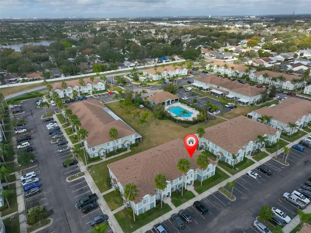 an aerial view of residential houses with outdoor space