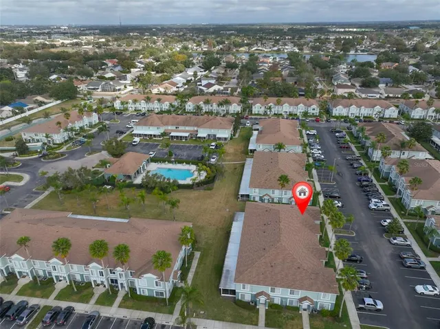 an aerial view of residential houses with outdoor space
