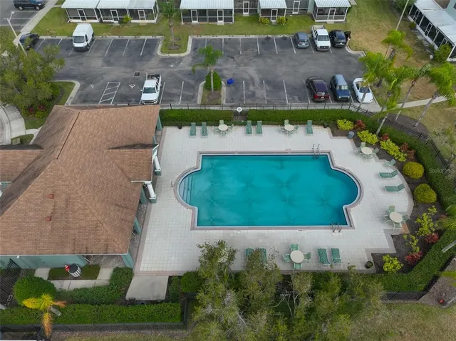 an aerial view of a house with a garden and a yard