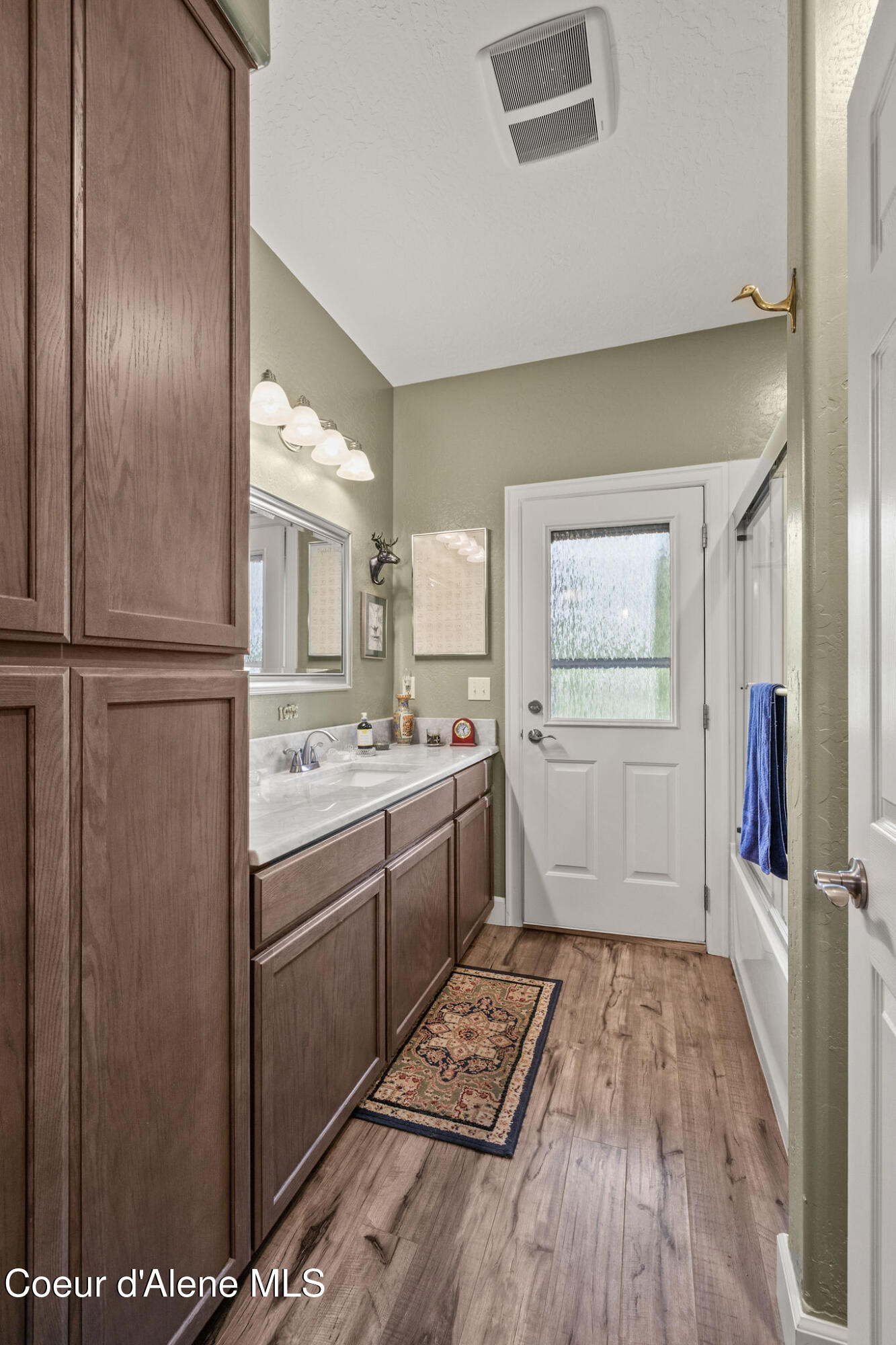 10986 North Rocking R Road Hayden, ID 83835 - Photo 24 of 43 Bathroom #2 With Door to Dog Kennel