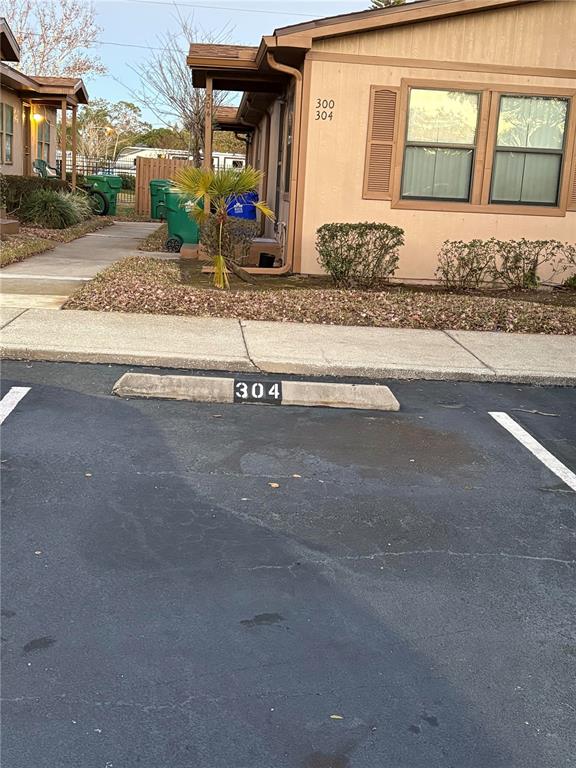 304 Eron Way, Unit 2 Winter Garden, FL 34787 - Photo 18 of 19 front view of a house with a street