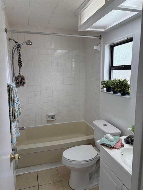 304 Eron Way, Unit 2 Winter Garden, FL 34787 - Photo 9 of 19 a bathroom with a sink toilet and shower