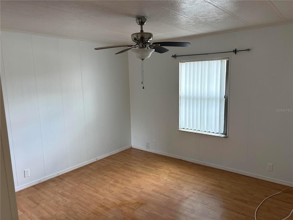 304 Eron Way, Unit 2 Winter Garden, FL 34787 - Photo 10 of 19 an empty room with a window and a fan