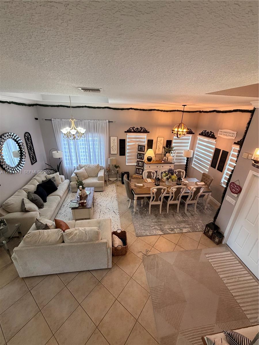 2116 Northeast 38th Road, Unit 2116 Homestead, FL 33033 - Photo 6 of 31 a view of a livingroom with furniture and couches