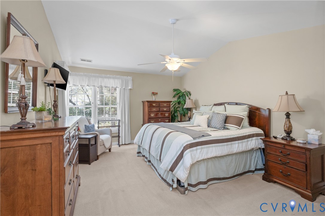 2205 Magnolia Grove Way Midlothian, VA 23113 - Photo 19 of 37 a bedroom with a bed and large windows