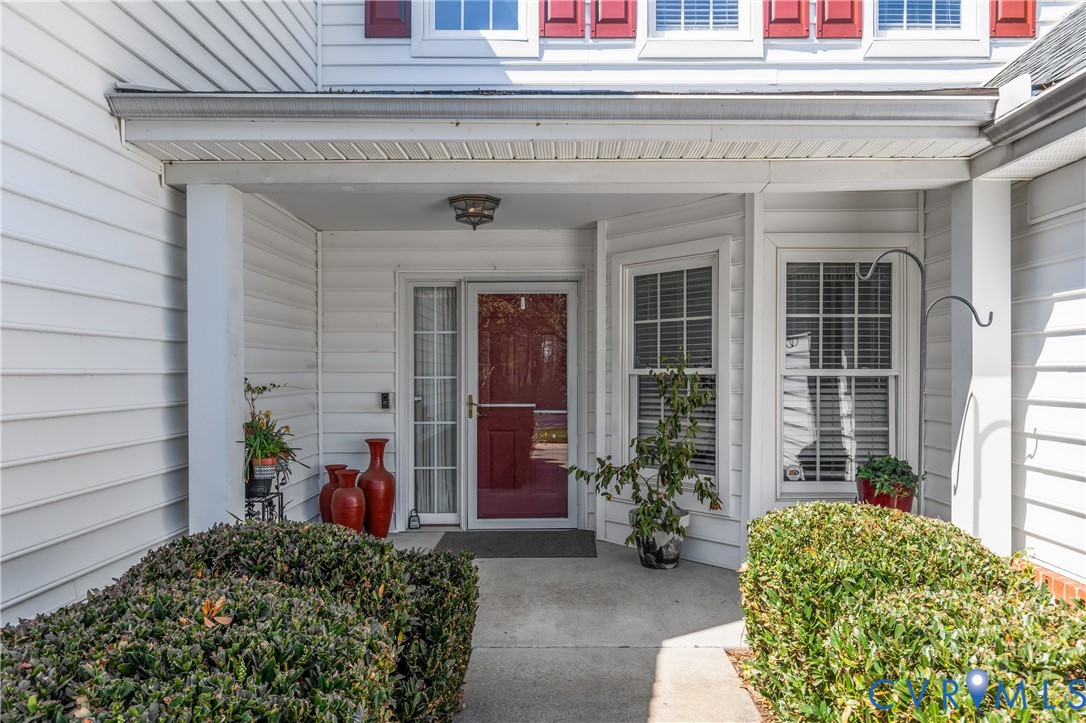 2205 Magnolia Grove Way Midlothian, VA 23113 - Photo 2 of 37 a view of a house with chair and porch