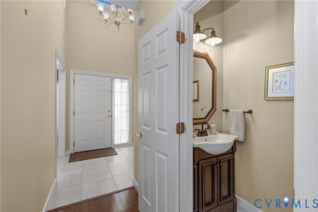 2205 Magnolia Grove Way Midlothian, VA 23113 - Photo 26 of 37 a bathroom with a sink vanity and a mirror