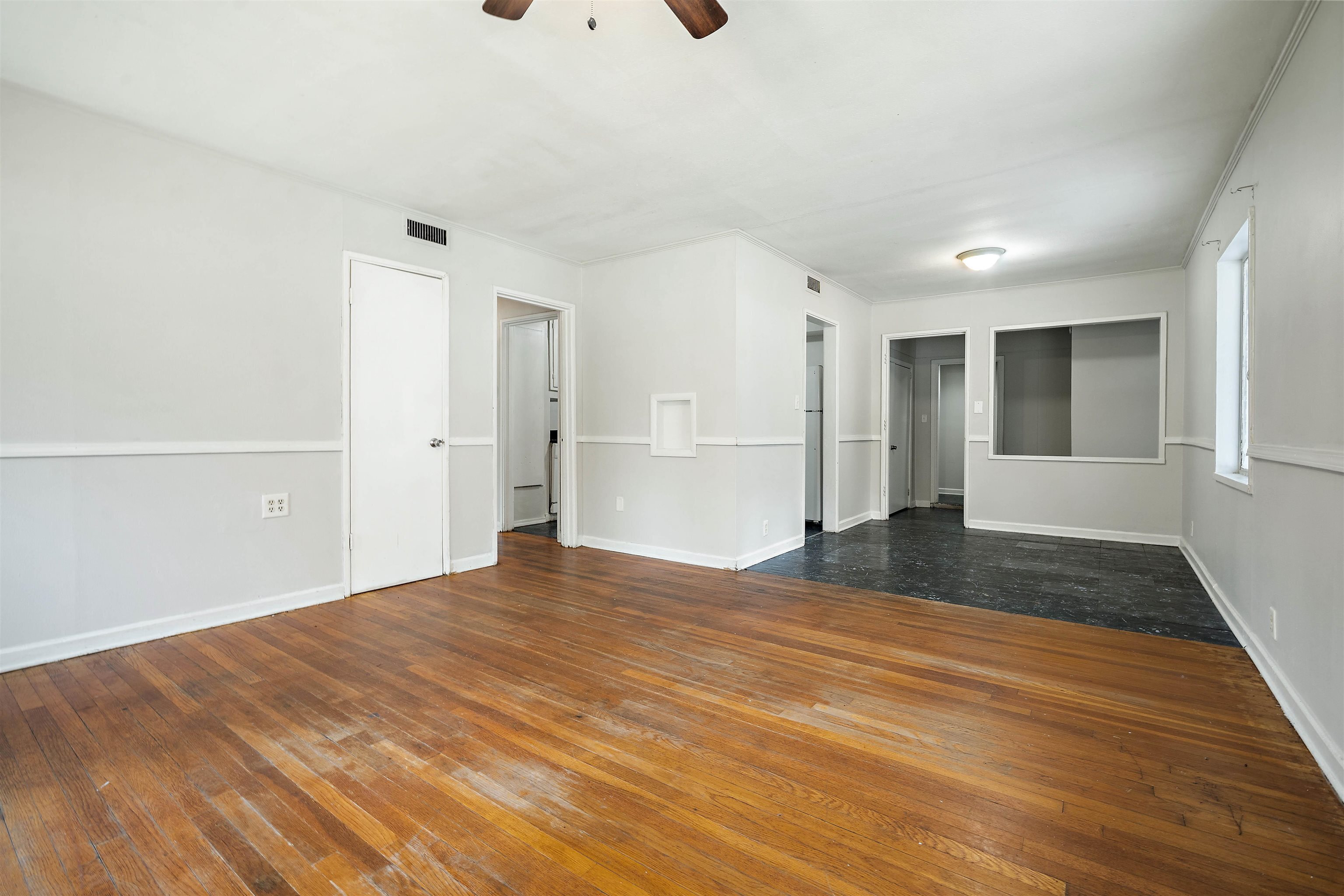 3014 Farcott Street Mobile, AL 36606 - Photo 4 of 26 Spare room with dark wood-type flooring and a ceiling fan