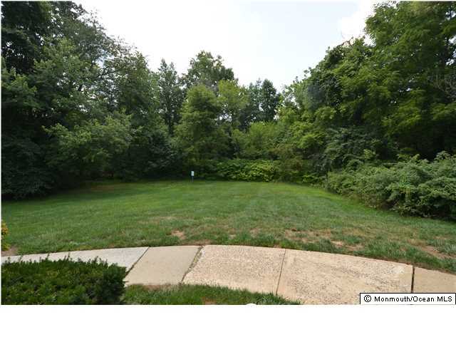 512 Harding Road, Unit 2 Freehold, NJ 07728 - Photo 11 of 12 a view of an outdoor space and a yard