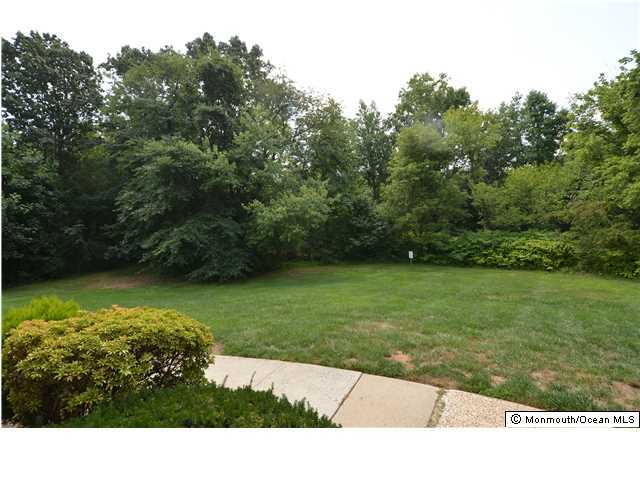 512 Harding Road, Unit 2 Freehold, NJ 07728 - Photo 12 of 12 a view of a garden with a building