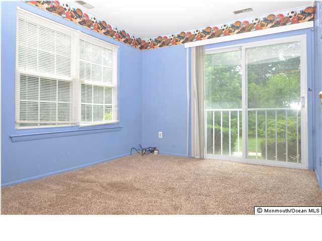 512 Harding Road, Unit 2 Freehold, NJ 07728 - Photo 2 of 12 a house view with a garden