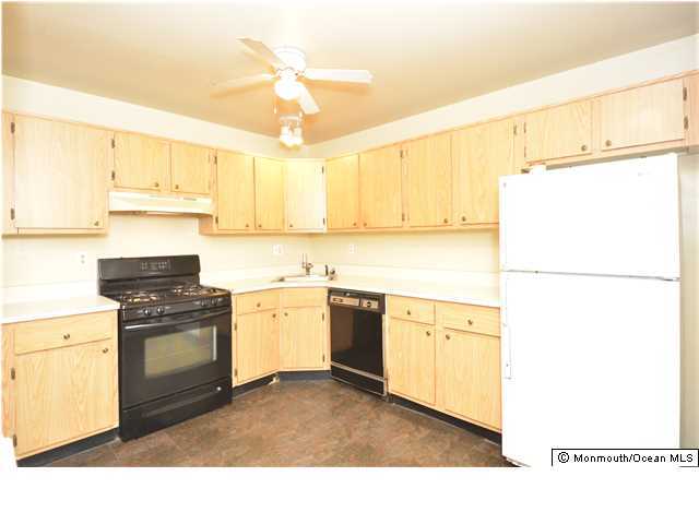 512 Harding Road, Unit 2 Freehold, NJ 07728 - Photo 3 of 12 a kitchen with appliances cabinets and a sink