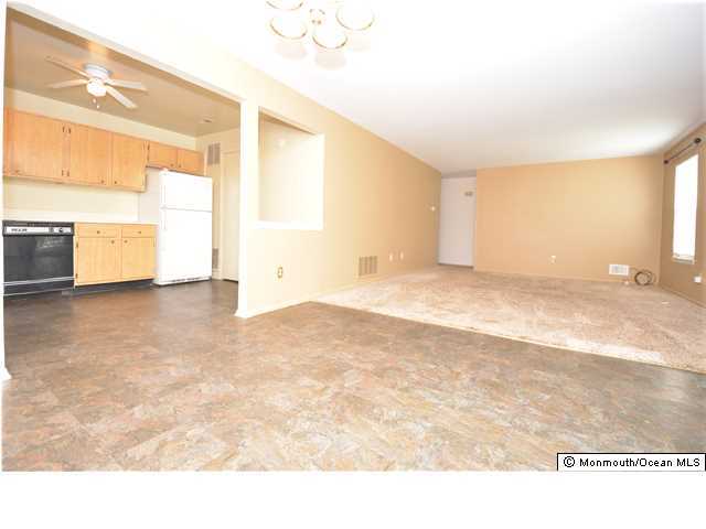 512 Harding Road, Unit 2 Freehold, NJ 07728 - Photo 4 of 12 a view of empty room with wooden floor