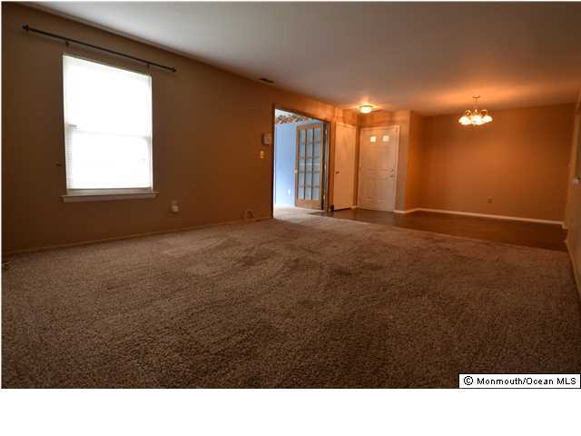 512 Harding Road, Unit 2 Freehold, NJ 07728 - Photo 9 of 12 a room with high traffic