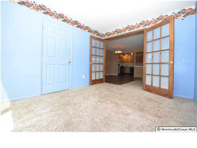 512 Harding Road, Unit 2 Freehold, NJ 07728 - Photo 10 of 12 a view of a livingroom with furniture and cabinet