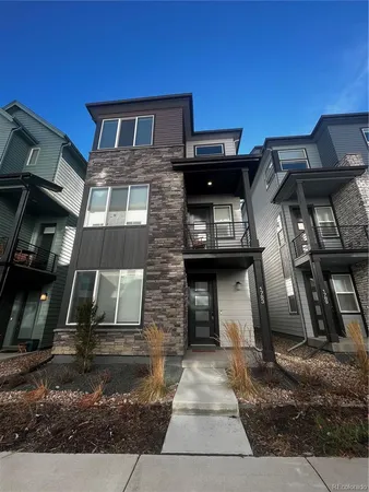 a front view of a house with parking