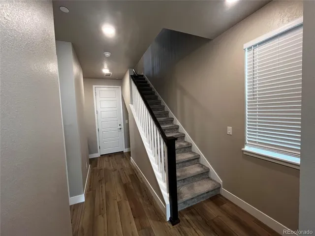 a bedroom with a bed and a table in it