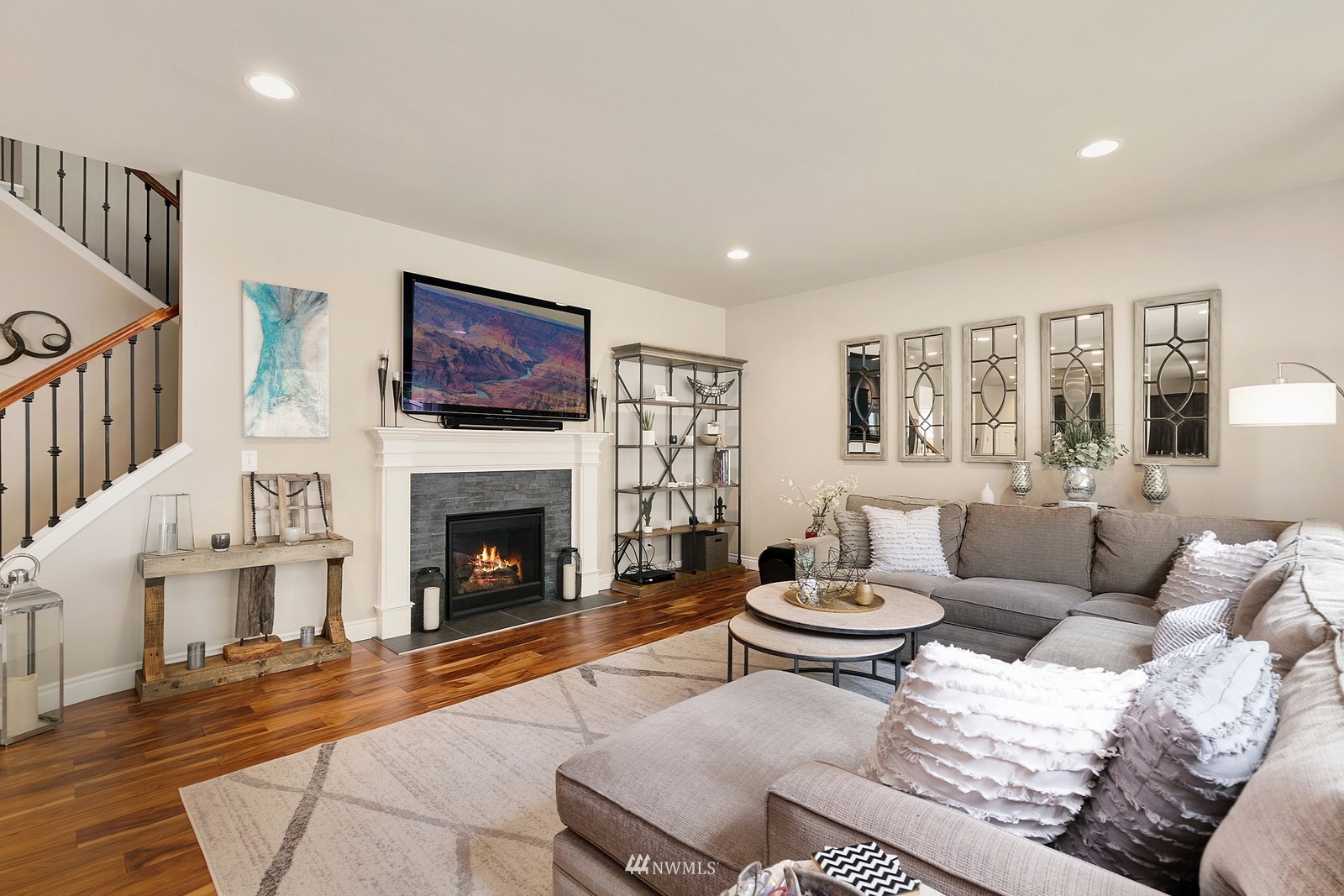 14114 163rd Place Southeast Renton, WA 98059 - Photo 13 of 33 a living room with furniture a fireplace and a large mirror