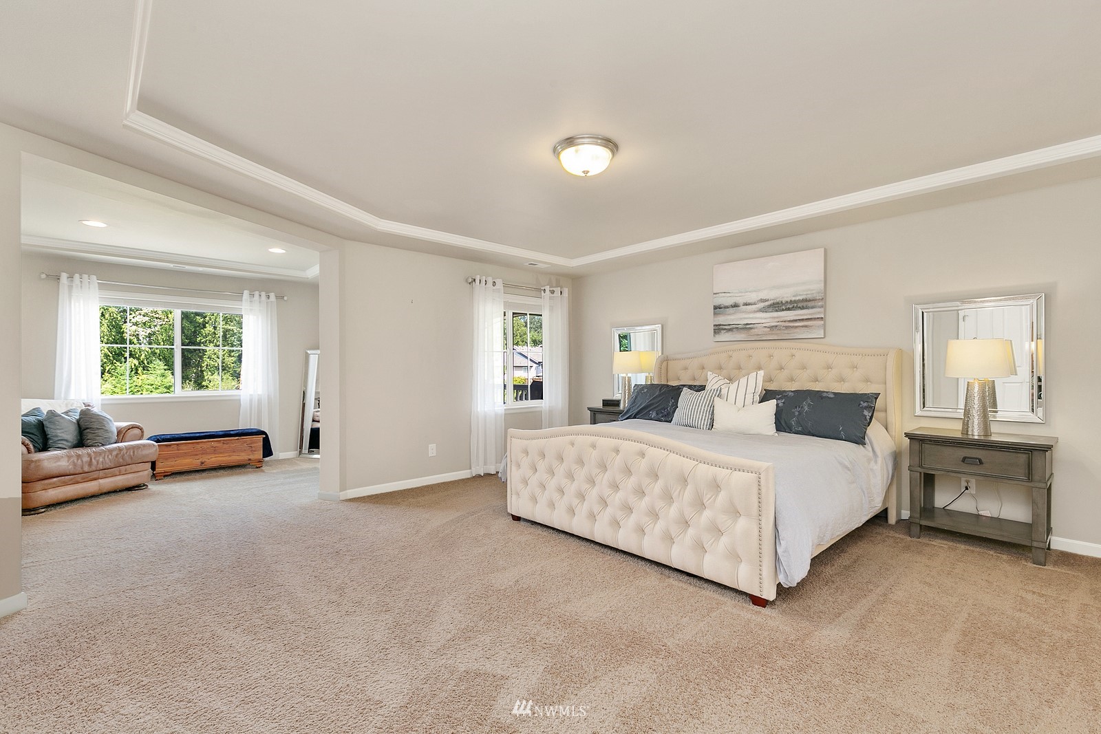 14114 163rd Place Southeast Renton, WA 98059 - Photo 14 of 33 a spacious bedroom with a bed and a couch