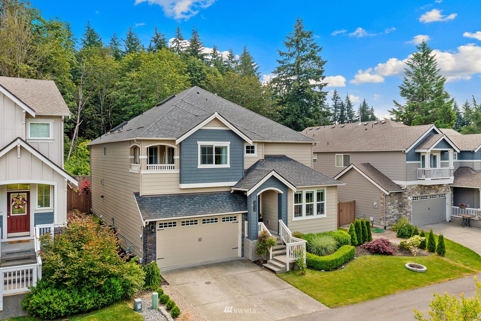 14114 163rd Place Southeast Renton, WA 98059 - Photo 2 of 33 a front view of a house with garden