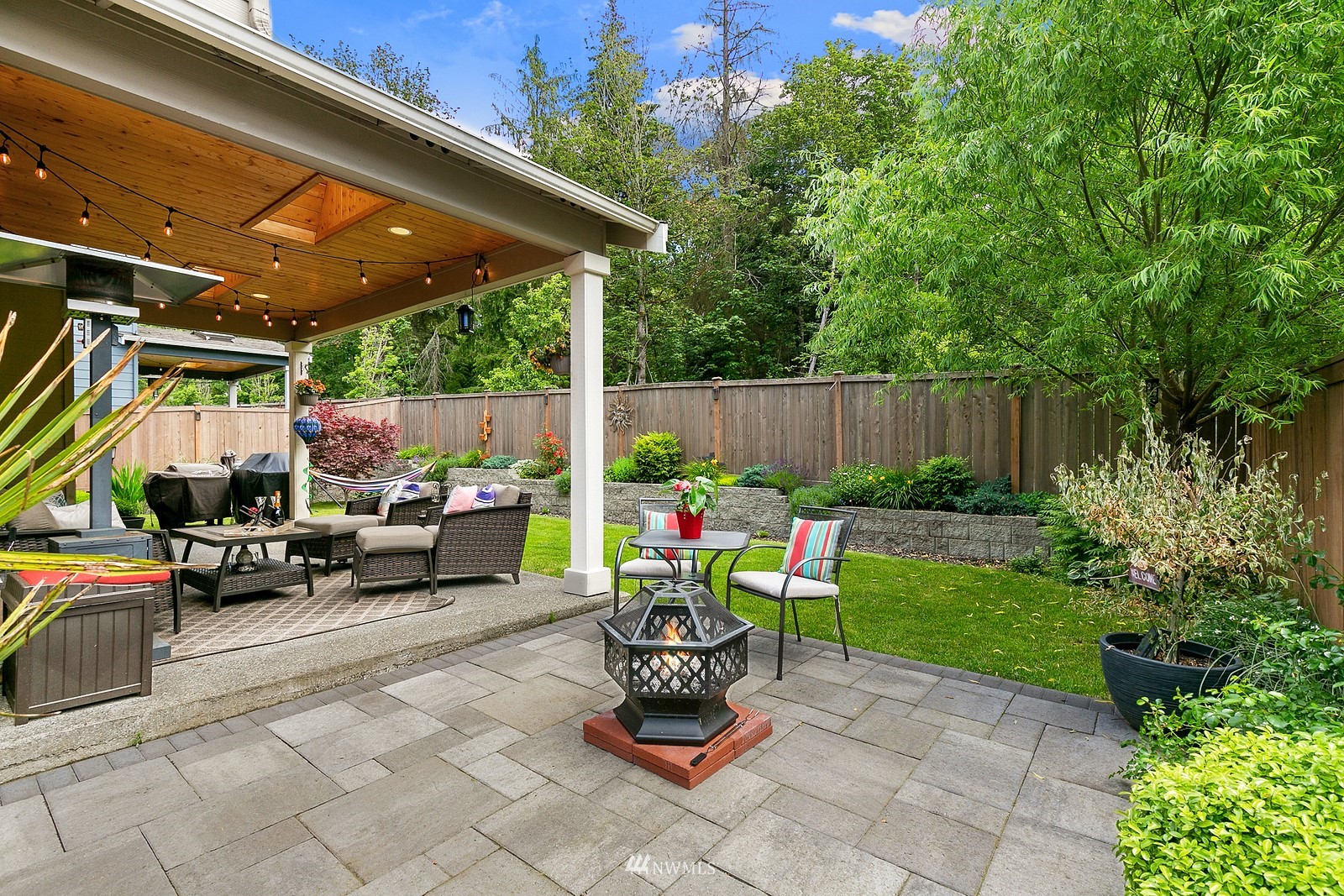 14114 163rd Place Southeast Renton, WA 98059 - Photo 25 of 33 a view of backyard with seating space and trees in the background