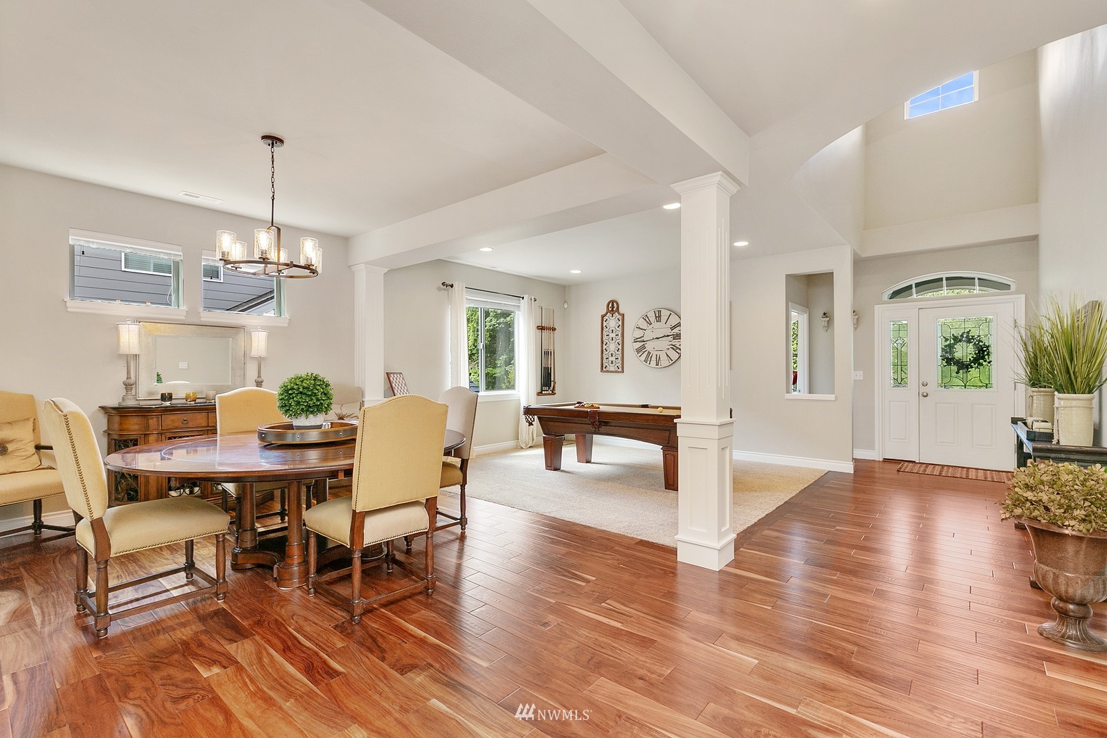 14114 163rd Place Southeast Renton, WA 98059 - Photo 5 of 33 a view of a dining room with furniture window and wooden floor