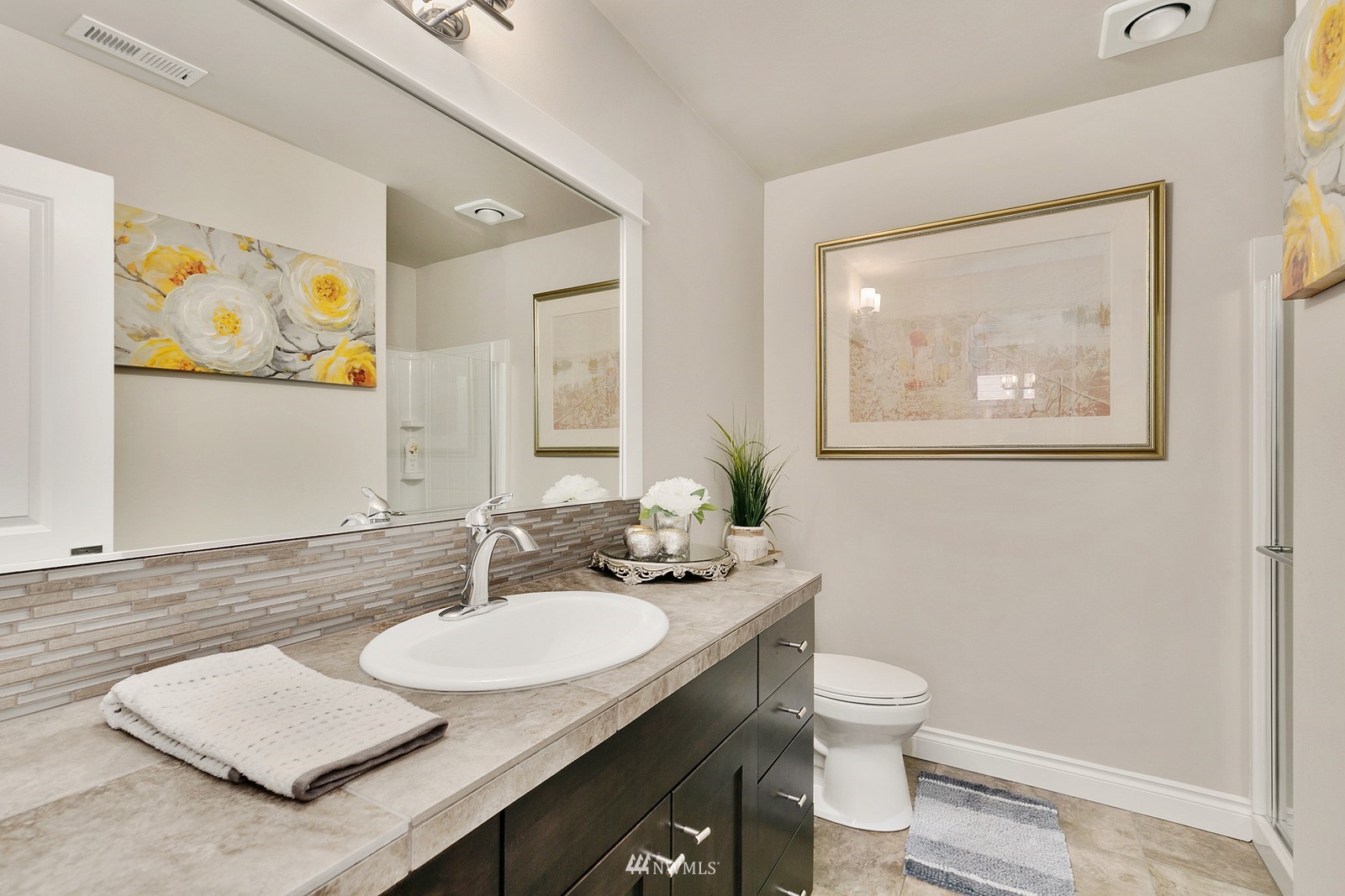 14114 163rd Place Southeast Renton, WA 98059 - Photo 7 of 33 a bathroom with a granite countertop sink and a mirror
