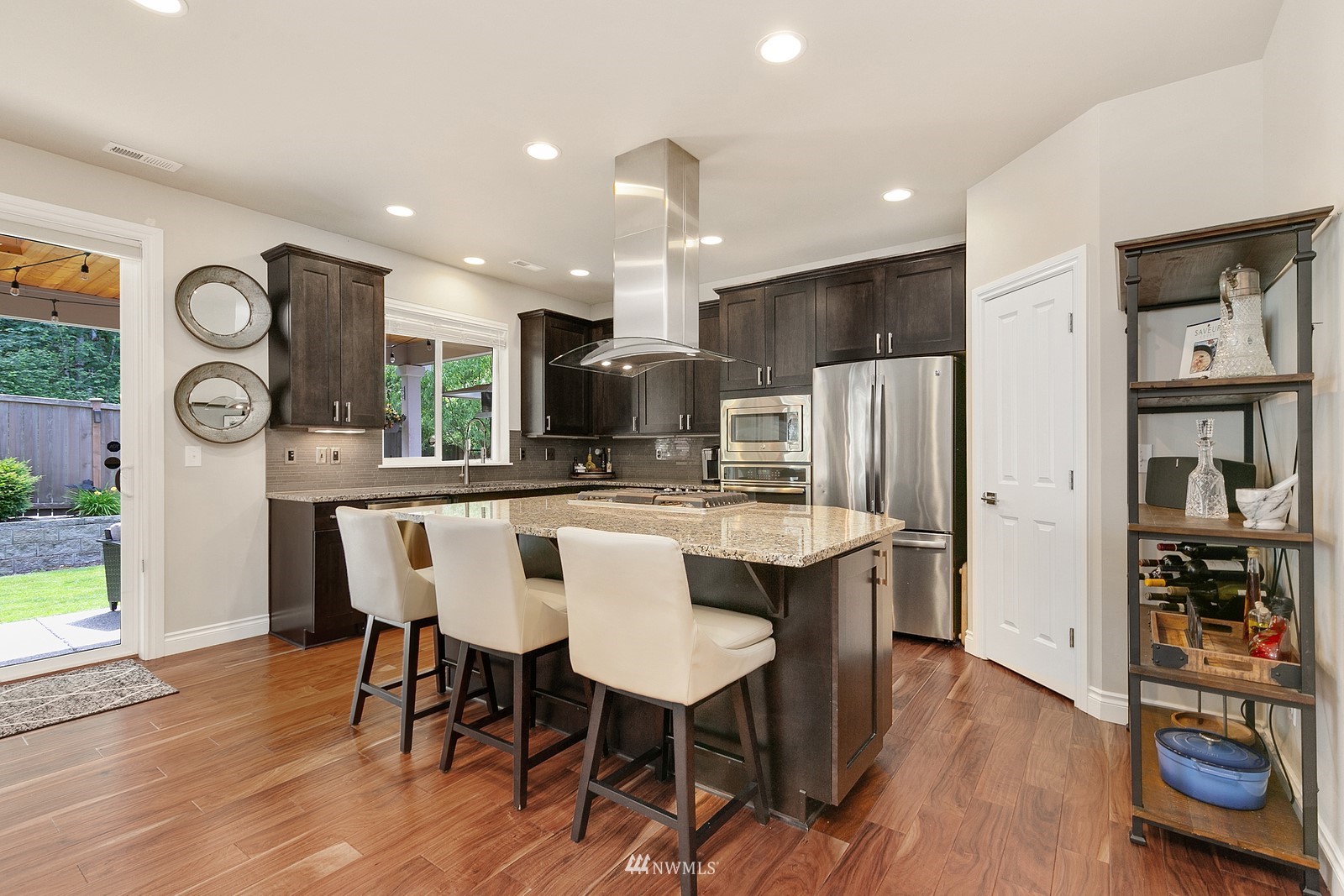 14114 163rd Place Southeast Renton, WA 98059 - Photo 8 of 33 a large kitchen with a table and chairs