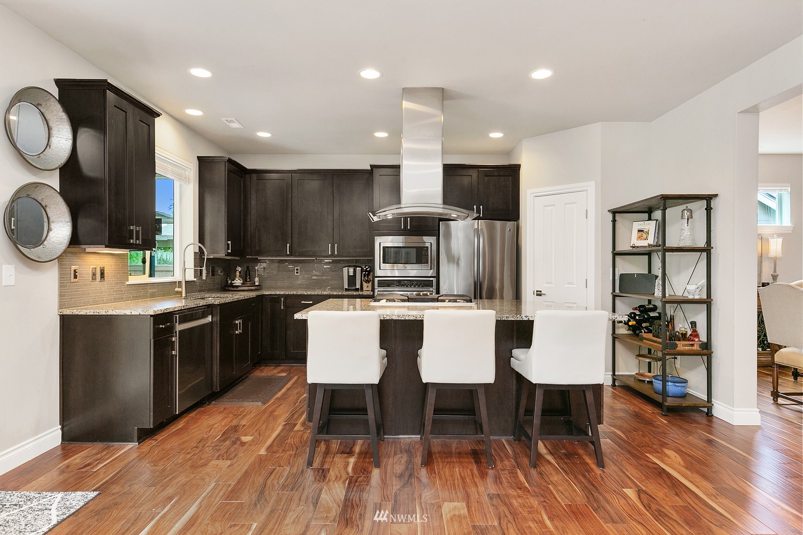 14114 163rd Place Southeast Renton, WA 98059 - Photo 9 of 33 a large kitchen with a table and chairs